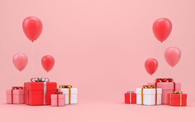 Red balloons against pink background