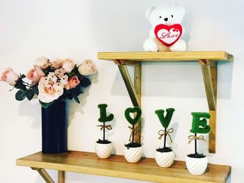 Close-up of flower vase on table at home