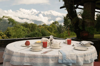 Table and chairs and tables in front of built structure