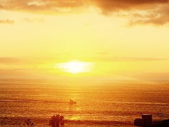 Scenic view of sea against sky at sunset