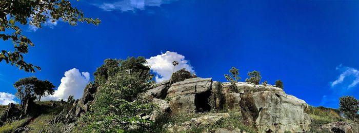 Low angle view of rock formation against sky