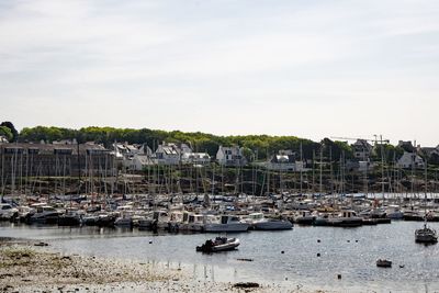 Boats in sea against sky