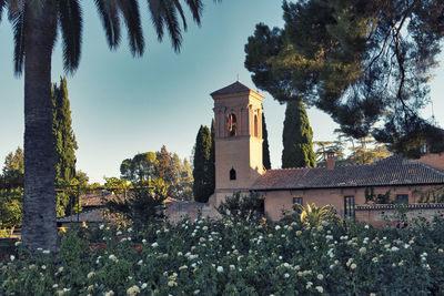 View of the gardens located around the site of the alhambra with its flowers and churches