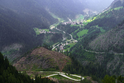 High angle view of road amidst trees and mountains