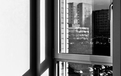 Reflection of buildings on glass window