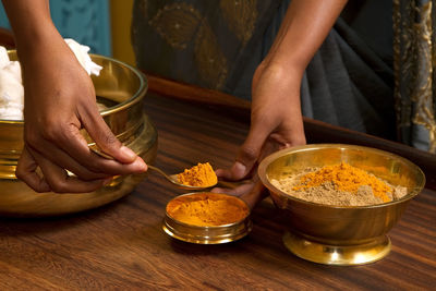 Midsection of woman preparing food