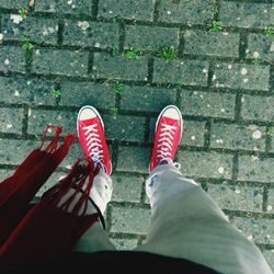 Low section of person standing on street