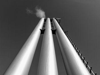 Low angle view of smoke stacks