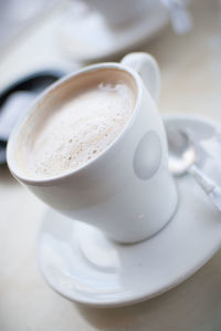 Close-up of coffee cup on table