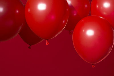 Balloons against red background