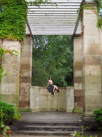 Man on staircase against building