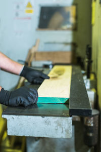 Cropped hands of man working on table