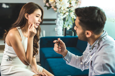 Happy young woman looking at camera