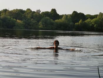 Man swimming in lake