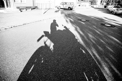 High angle view of shadow on street in city