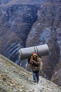 Rear view of man standing on mountain