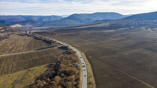 Aerial view of road on landscape against sky