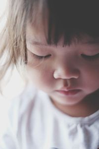 Close-up of cute girl at home