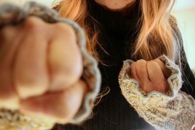 Close-up of woman with hand in hair