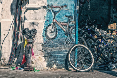 Bicycle parked against wall