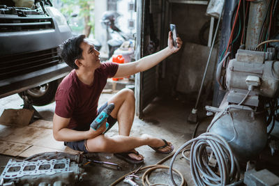 High angle view of man working at workshop