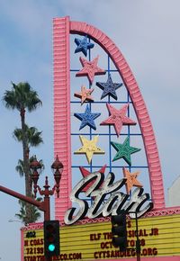 Low angle view of multi colored building against sky