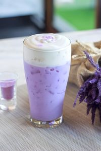 Close-up of purple drink on table