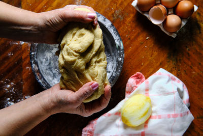 High angle view of person preparing food on table