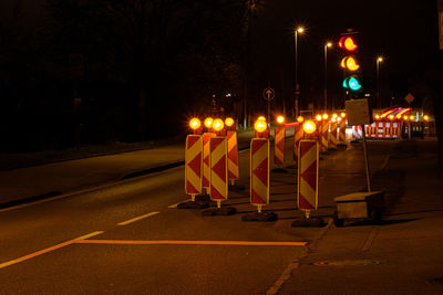 Traffic light at a construction site in night