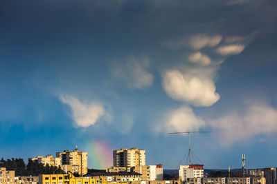 Buildings in city against sky