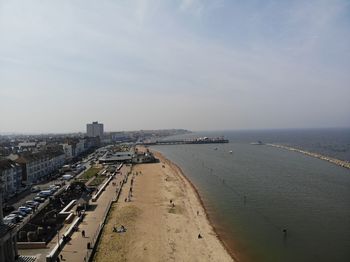 High angle view of buildings against cloudy sky