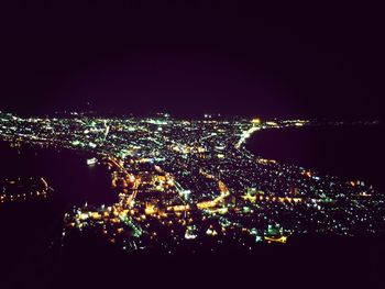 Aerial view of illuminated cityscape at night