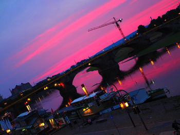 Panoramic view of illuminated buildings against sky during sunset