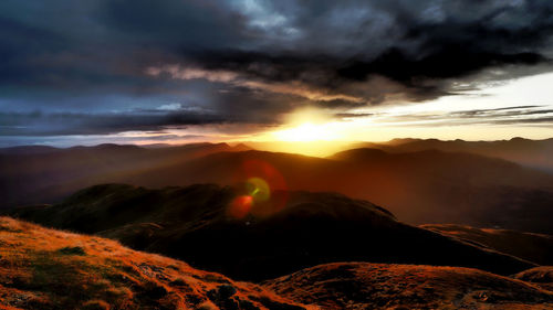 Scenic view of mountains against sky during sunset