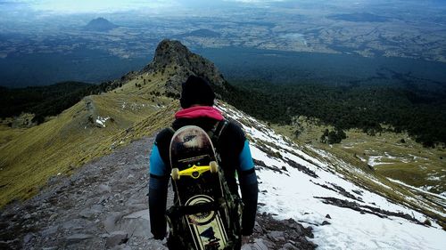 Man hiking on snow covered landscape