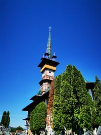 Low angle view of traditional building against clear blue sky