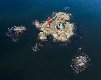 Aerial view of island with lighthouse