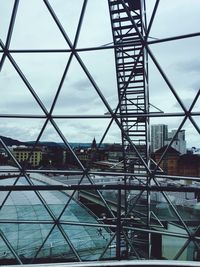 Bridge against sky in city