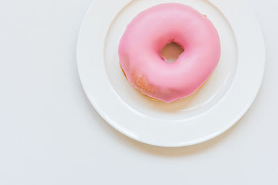 High angle view of pink cake on plate