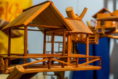 Close-up of chairs on table