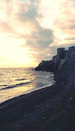 Scenic view of sea against sky at sunset