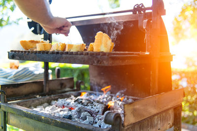 Cropped hand of man preparing food