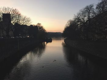 Scenic view of river at sunset