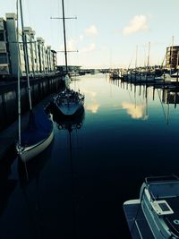 Boats moored at harbor