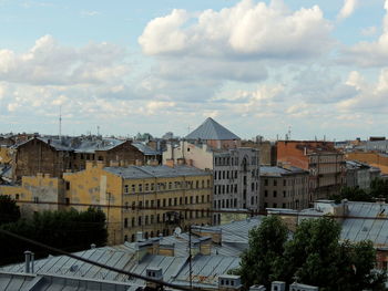 High angle view of buildings in city against sky