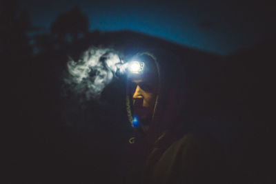 Young man in illuminated light