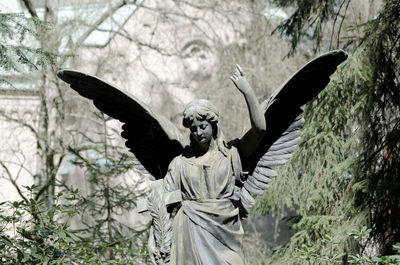 View of angel sculpture in a cemetery