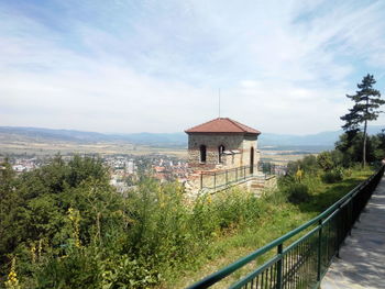 Built structure on landscape against sky