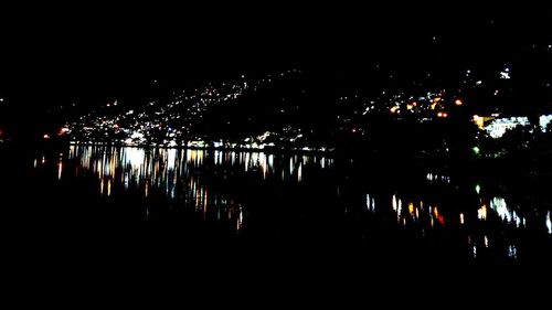 Silhouette of illuminated city at night