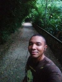 Portrait of smiling man in forest